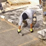 professional-landscape-workers-paving-driveway-600nw-2113261418
